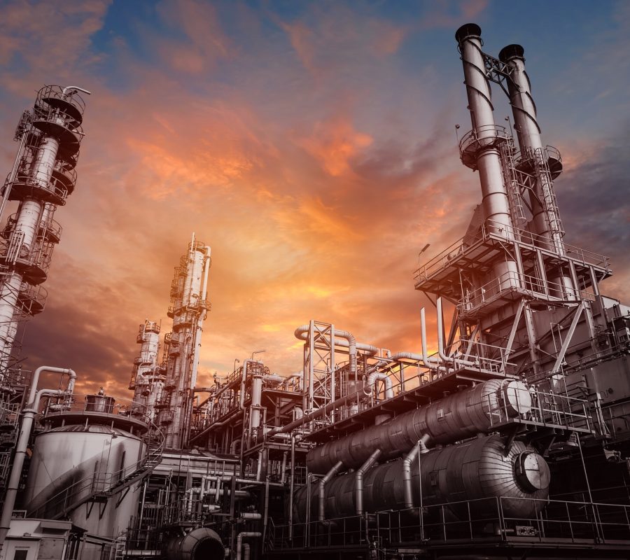 industrial-furnace-and-heat-exchanger-cracking-hydrocarbons-in-factory-on-sky-sunset-close-up-of-equipment-in-petrochemical-plant-min